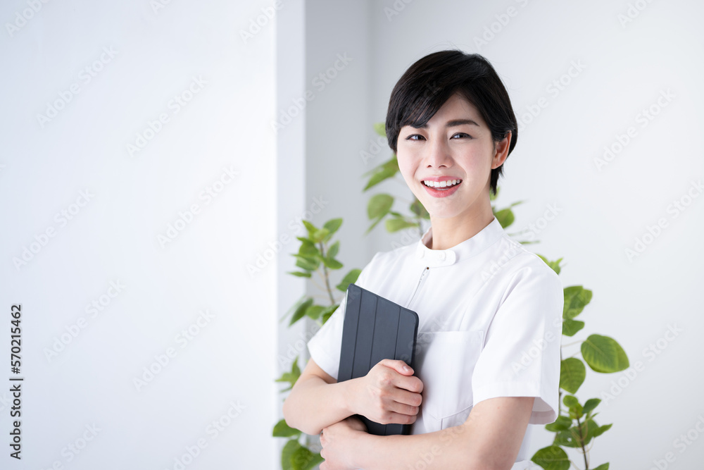Hospital receptionist or nurse or nursing assistant with an image of a hospital. Hospital receptionist or nurse or nursing assistant with an image of a hospital.