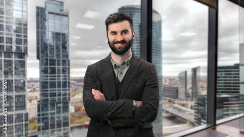 Smiling charismatic male boss brutal success manager posing downtown skyscraper district cityscape Smiling charismatic male boss brutal success manager posing downtown skyscraper district cityscape
