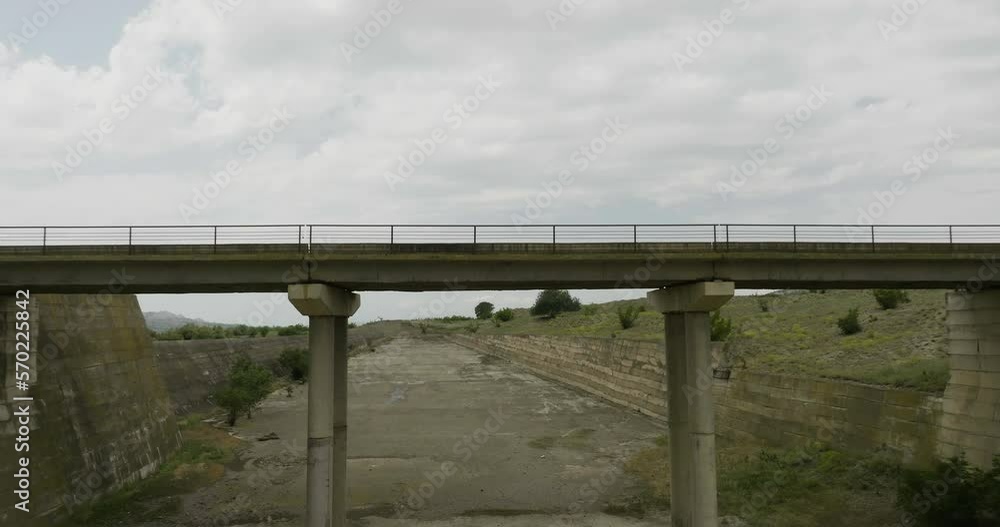 Bridge over dried up concrete sluice riverbed of Dali Mta reservoir. Bridge over dried up concrete sluice riverbed of Dali Mta reservoir.