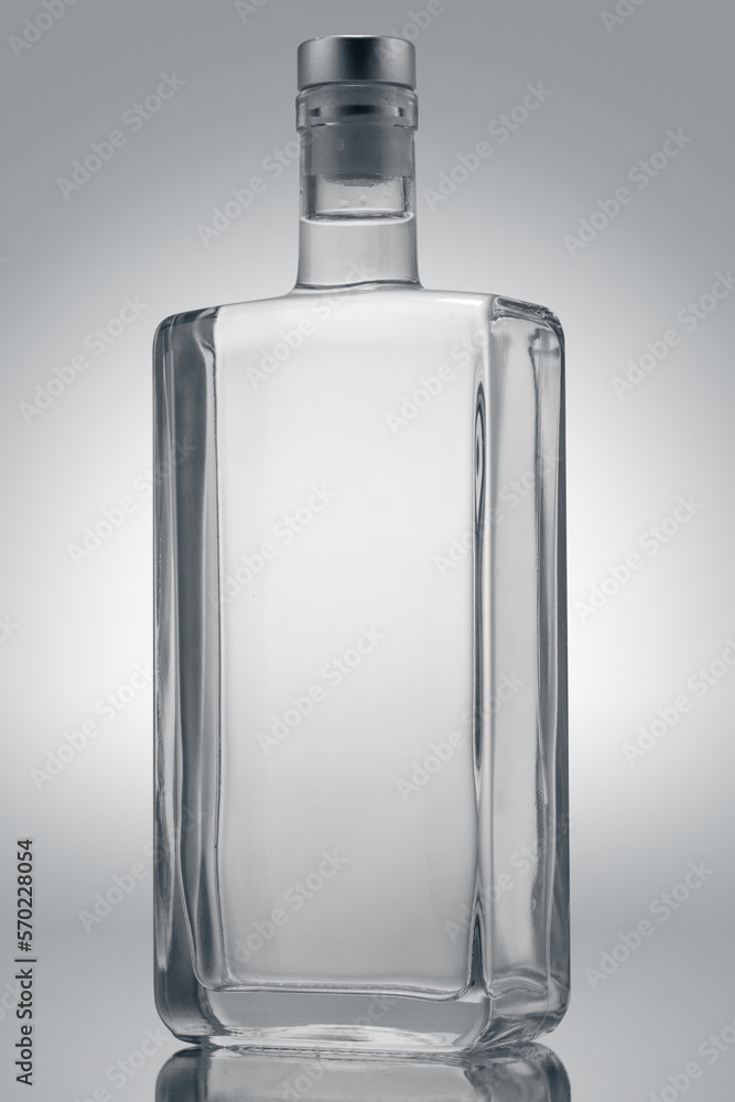 Glass bottle of vodka, gin, tequila or rum, isolated on white background. Template for product design. Glass bottle of vodka, gin, tequila or rum, isolated on white background. Template for product design.