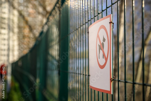 No dogs allowed sing on a fence