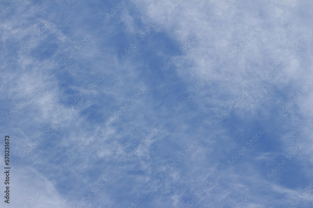 Blue sky and white clouds. Background. Layer. Texture. Seelctive focus. Out of focus. Copy space
