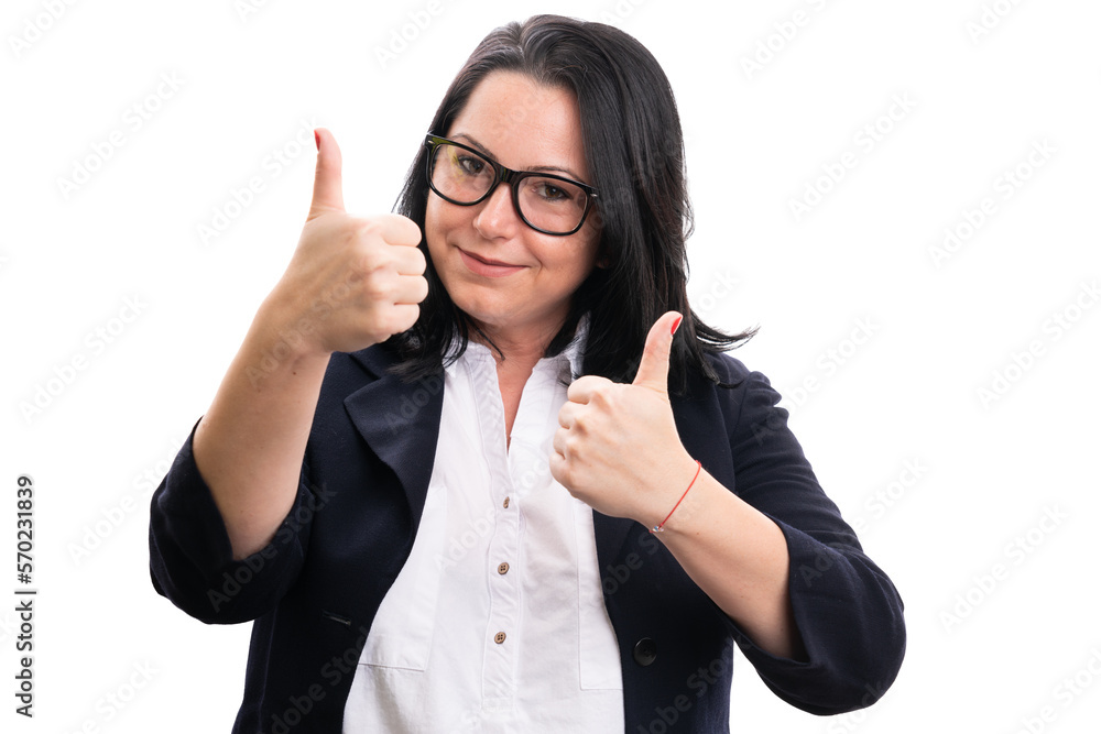 Cheerful businesswoman wearing glasses showing double thumbs-up Cheerful businesswoman wearing glasses showing double thumbs-up