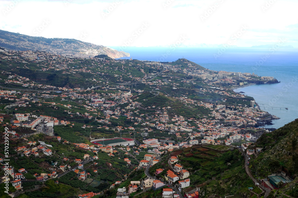 A typical view across Madeira above Funchal, showing patchwork of fields and houses with tunnels
