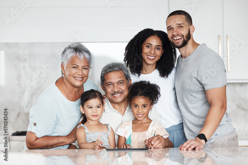 Big family, portrait and smile in a kitchen with grandparents, children and parents at home. Mom, kids and senior people together with happiness, love and parent care in a house feeling happy
