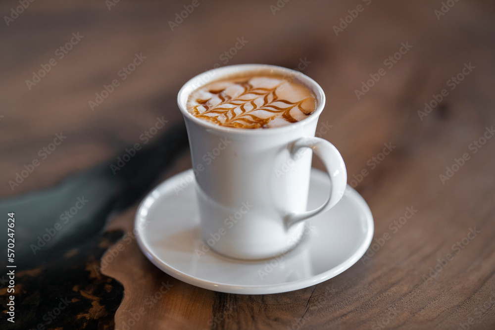 Fototapeta premium delicious latte coffee on wooden table