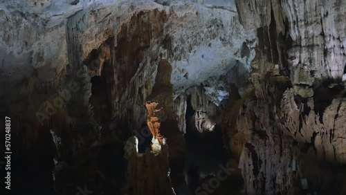 A beautiful cave lit from the inside with stalagtites and stalagmites, in Phong Nha, Vietnam photo