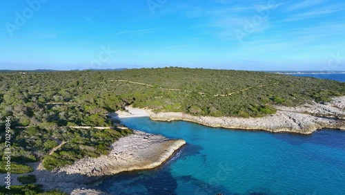 Aerial View Of Son Saura Virgin Beach On A Clear Blue Sky Day In Menorca Spain, Tracking Wide Shot photo