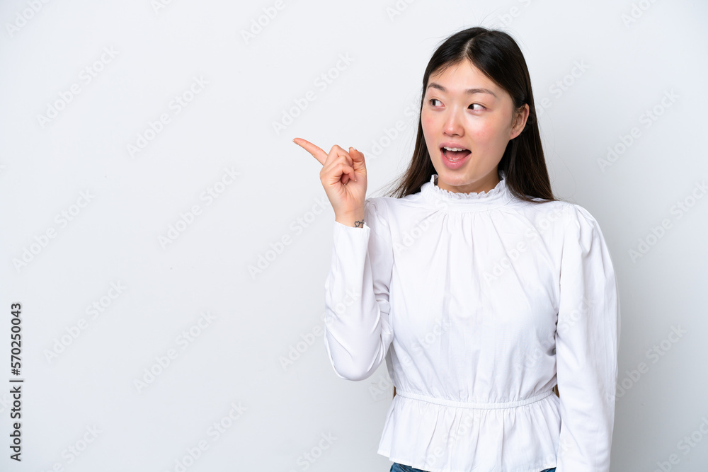 Young Chinese woman isolated on white background intending to realizes the solution while lifting a finger up Young Chinese woman isolated on white background intending to realizes the solution while lifting a finger up