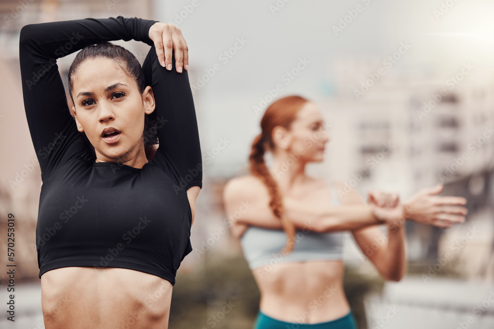 Fototapeta premium Exercise, friends and women in city stretching arms for outdoor workout on bridge or road for health and wellness. Sports, motivation and fitness mindset, urban training and people stretch together.