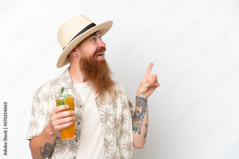 Redhead man with long beard drinking a cocktail on a beach isolated on white background intending to realizes the solution while lifting a finger up Redhead man with long beard drinking a cocktail on a beach isolated on white background intending to realizes the solution while lifting a finger up