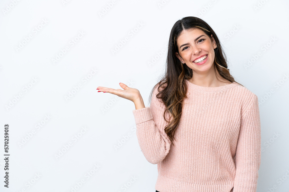 Young Italian woman isolated on white background holding copyspace imaginary on the palm to insert an ad Young Italian woman isolated on white background holding copyspace imaginary on the palm to insert an ad