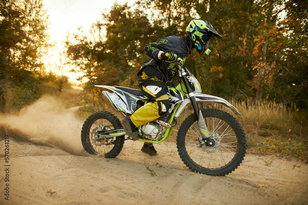 Enduro rider on an enduro motorcycle. Photo of an enduro rider. a ...