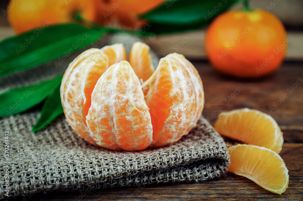peeled ripe sweet mandarine tangerine on burlap napkin peeled ripe sweet mandarine tangerine on burlap napkin