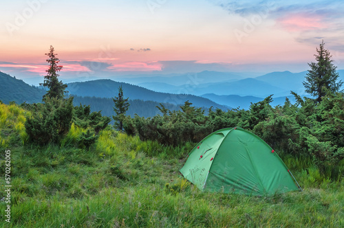 tent in the carpathian mountains at beautiful sunset