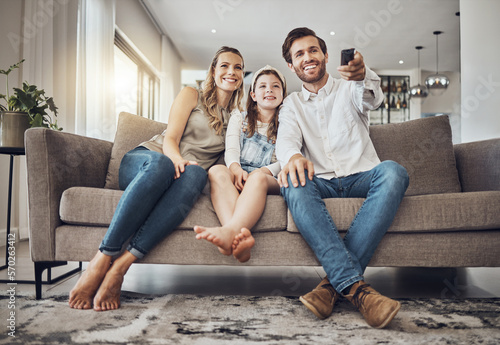 Girl, mother or father watching tv to relax as a happy family in living room bonding in Australia with love. Television, sofa or parents smile with kid enjoying quality time or movies on fun holiday