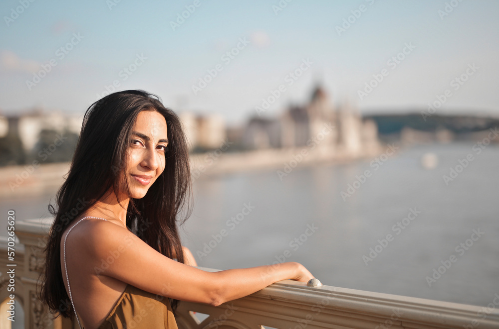portrait of a young woman on a bridge in Budapest portrait of a young woman on a bridge in Budapest