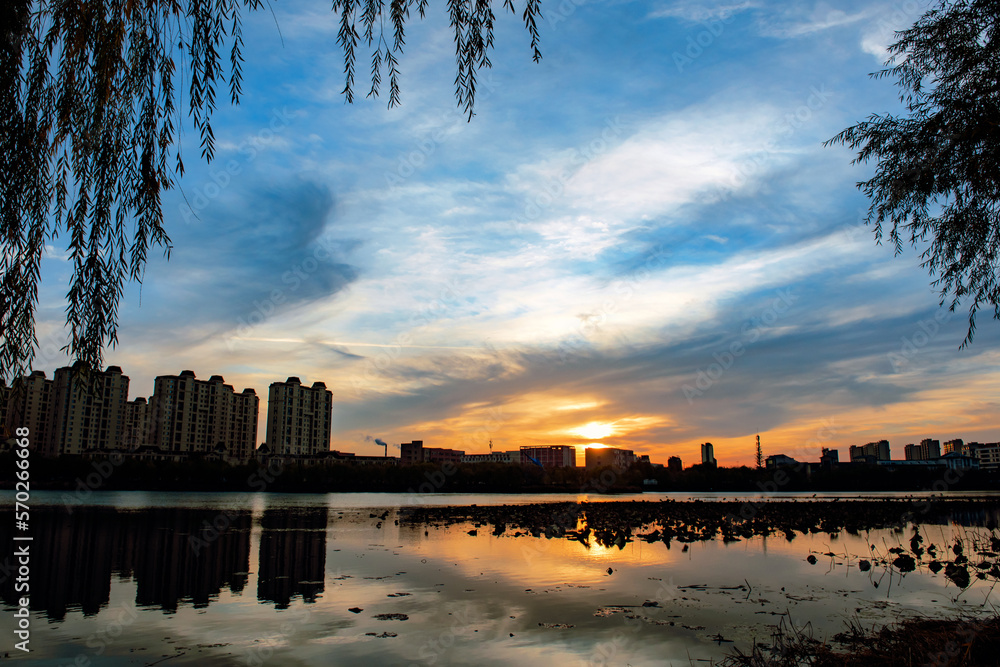 The river in the city Park reflects the city skyline against a ...