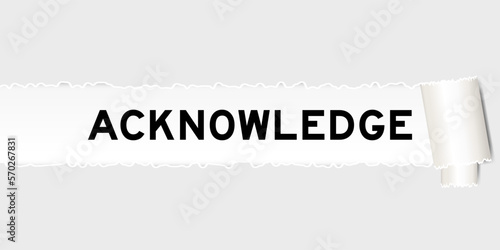 Ripped gray paper background that have word acknowledge under torn part