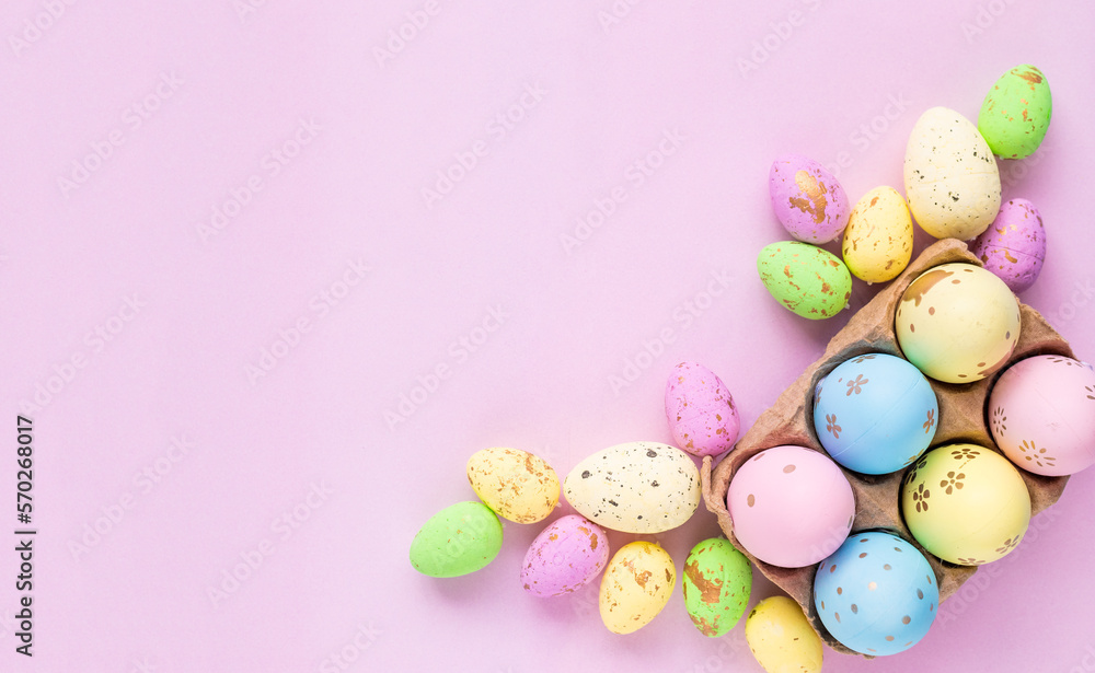 Multicolored eggs on a lilac background. Easter background, template with space for text