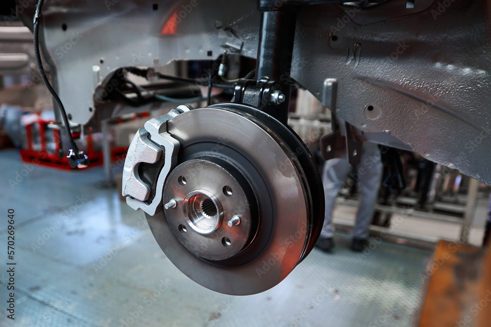 Assembled car suspension with brake mechanism in workshop Assembled car suspension with brake mechanism in workshop