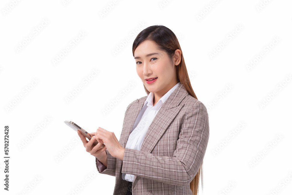 Professional Asian working woman in a white shirt and striped suit standing confidently smiling and looking at the camera is making smart phone to check information isolated on white background. Professional Asian working woman in a white shirt and striped suit standing confidently smiling and looking at the camera is making smart phone to check information isolated on white background.