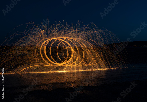 Burning wire wool image, light trails at night 