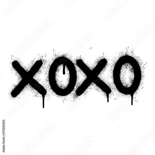 Spray Painted Graffiti xoxo Word Sprayed isolated with a white background. graffiti font xoxo with over spray in black over white.