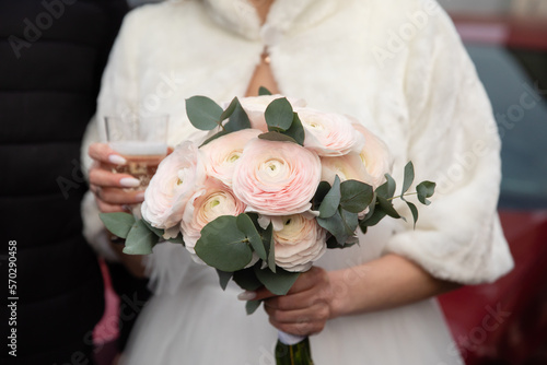 Bride's bouquet in the hands of the bride