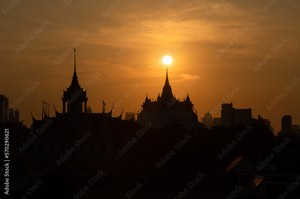 At a temple in the central of Bangkok Thailand, The morning sun will gradually move up to stand out at the end of this temple pagoda. This miracle happens only twice a year.