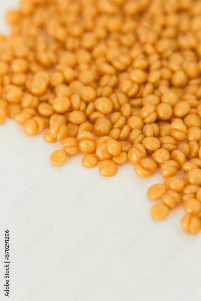 Beautiful golden depilatory wax granules, macro, close up, texture Beautiful golden depilatory wax granules, macro, close up, texture