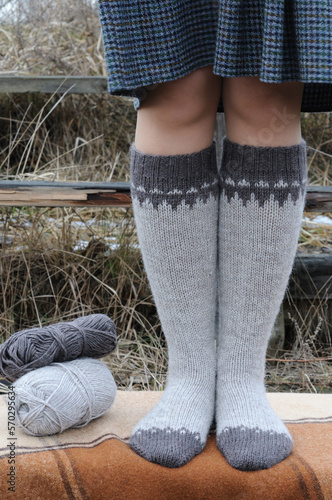 Knitted high socks with a pattern.  Front view.