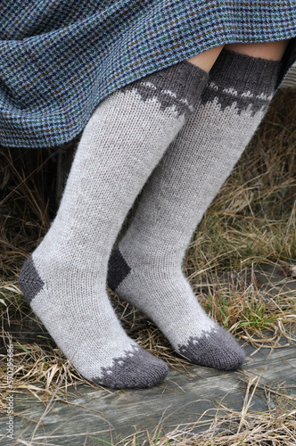 Knitted high socks with a pattern.  View from the side.