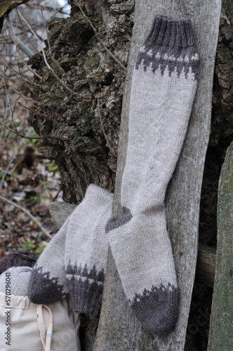 Knitted high socks with a pattern  in nature.  Front view.
