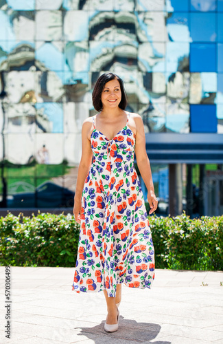Beautiful brunette middle aged woman in summer dress