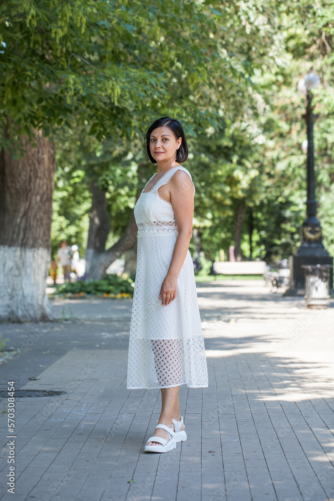 portrait of a young beautiful brunette woman in white dress portrait of a young beautiful brunette woman in white dress