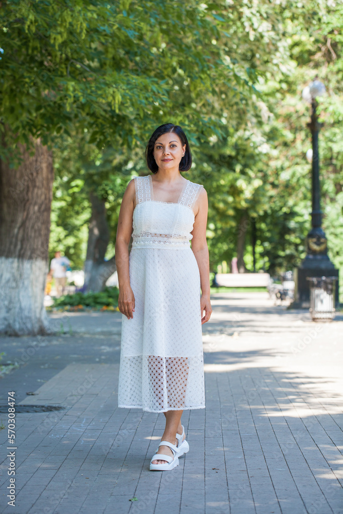 portrait of a young beautiful brunette woman in white dress portrait of a young beautiful brunette woman in white dress