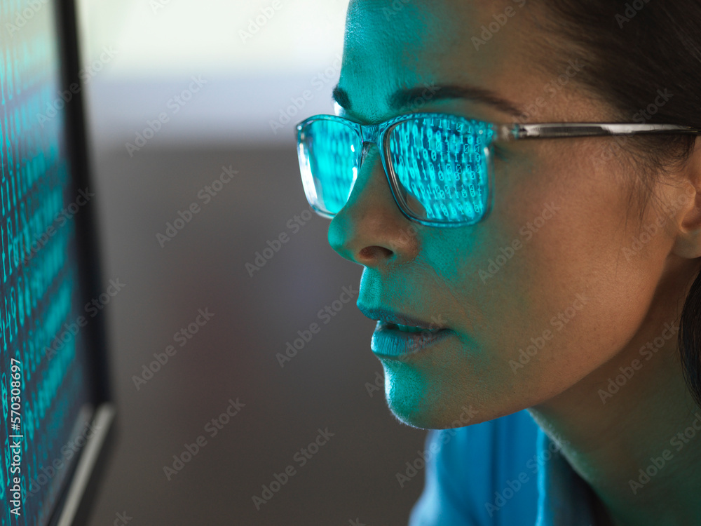 Close-up of programmer with binary code reflected in eyeglasses Close-up of programmer with binary code reflected in eyeglasses