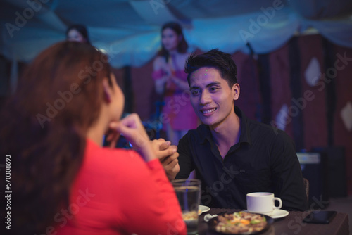 Photos The couple gets romantically excited as the man holds the woman's hand for the first time
