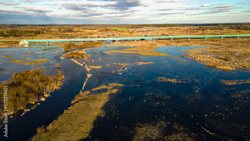 View from above on the bridge over the Narew River and its backwater on a sunny day.