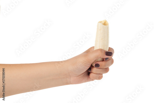 Hand holding whole banana isolated on white background