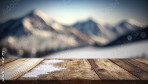 wooden table at the first plan, snow and mountain in the background, bokeh effet © Sébastien Jouve