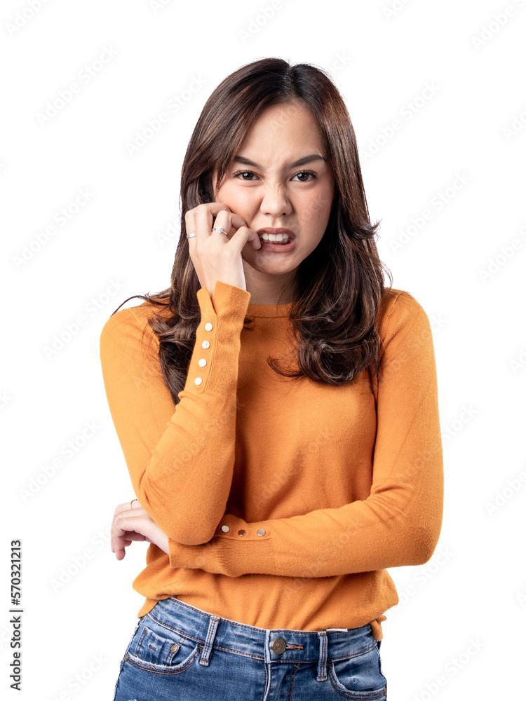 A portrait of a happy Asian Indonesian woman wearing an orange sweater, seen frustrated and angry, isolated on a white background A portrait of a happy Asian Indonesian woman wearing an orange sweater, seen frustrated and angry, isolated on a white background