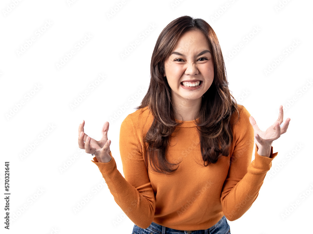 A portrait of a happy Asian Indonesian woman wearing an orange sweater, seen frustrated and angry, isolated on a white background A portrait of a happy Asian Indonesian woman wearing an orange sweater, seen frustrated and angry, isolated on a white background
