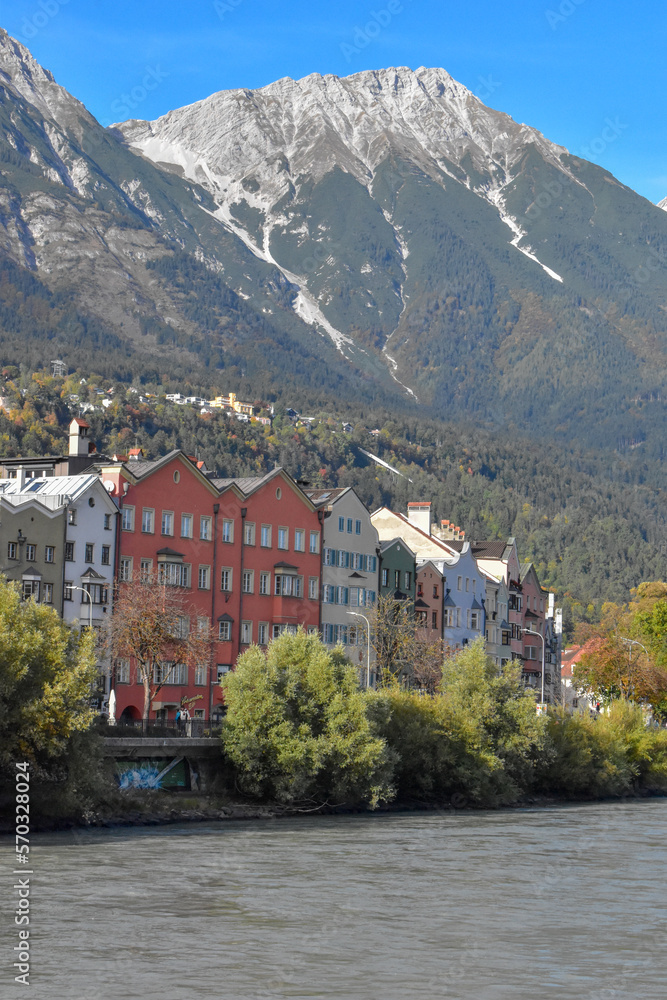 Fototapeta premium Panoramic view of the historic city center of Innsbruck with colorful houses along Inn river and famous Austrian.