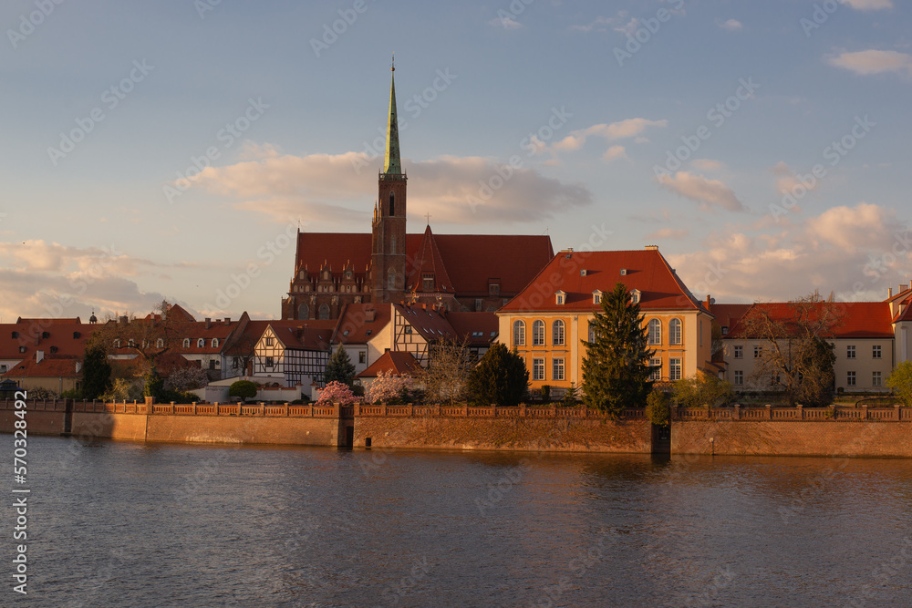 Poland, Wroclaw, April 16, 2022. View to Odra River and Tumski Island. Old Town of Wroclaw in Spring 