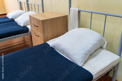 Obraz na plátně The made-up bed of a soldier in the barracks