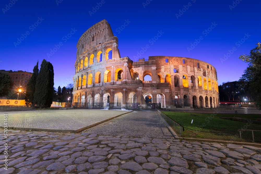 The Colosseum in Rome, Italy during blue hour.