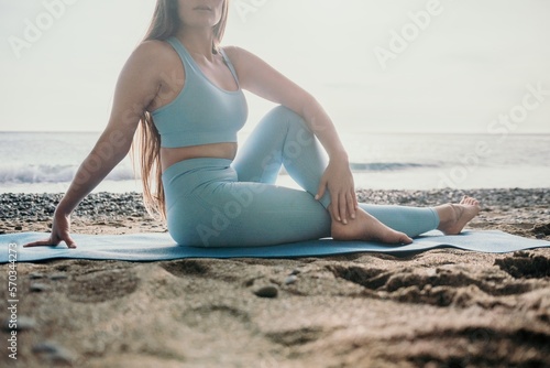 Woman sea pilates. Sporty happy middle aged woman practicing fitness on beach near sea, smiling active female training on yoga mat outside, enjoying healthy lifestyle, harmony and meditation.