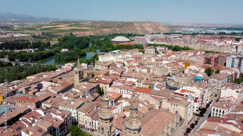 City of Logrono perspective from above. View of old town center with beautiful Cathedral of Santa María de la Redonda. Drone forward passing over the cathedral towers. In background Ebro River City of Logrono perspective from above. View of old town center with beautiful Cathedral of Santa María de la Redonda. Drone forward passing over the cathedral towers. In background Ebro River